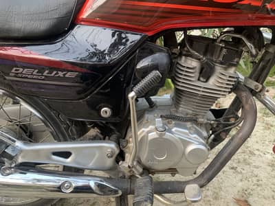 Honda deluxe red colour