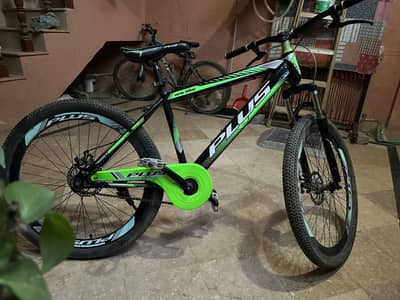 28 inch bicycle with helmet,mudguards and back seat.