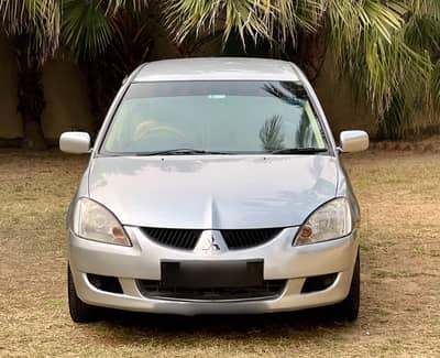 Mitsubishi Lancer GLX 1.3 manual, 2004 model in excellent condition.