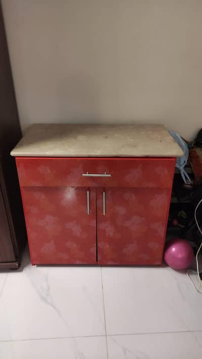 Marble top cupboard with one large drawer and cupboard