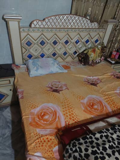 bed with dressing and side tabe