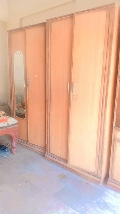 “Four-door wooden wardrobe with a mirror attached almari aur divider