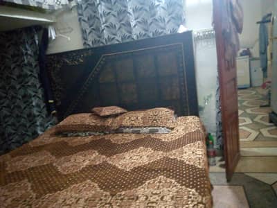 king size bed with two side table and dressing table