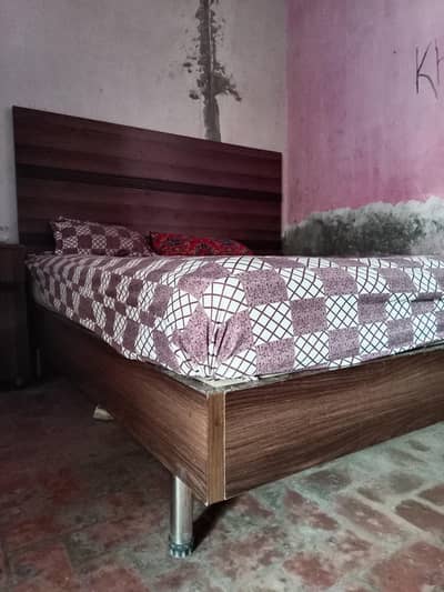 king size bed with mattress two side tables and dressing table