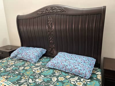 King size wooden bed with 2 side tables