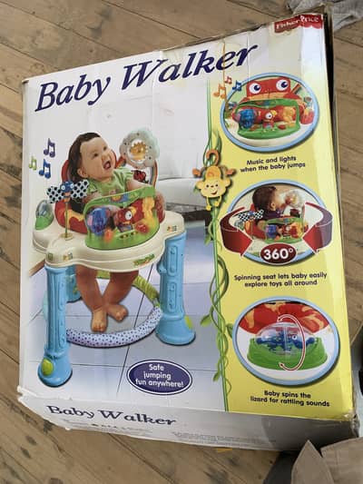Baby walker almost new with box Fisherprice