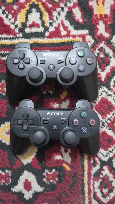 ps3 dual shock controllers  both