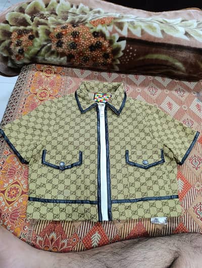 Gucci GG canvas jacket with leather trim in 12500 only