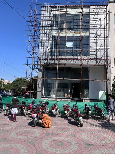 Strategically Located 6-Marla Corner Commercial Building For Rent In DHA Phase 4 Fully Equipped With Elevator, Functional Washrooms, And High-Visibility Frontage Near Major Banks & Offices