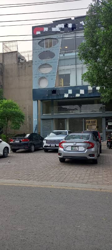 Triple-Level Commercial Masterpiece | Ground Floor Exposure, Mezzanine Elegance & Basement Utility 4-Marla Business Space in DHA Phase 4s Most Strategic & High-Footfall Zone