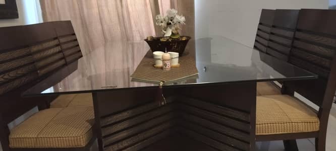 Glass table with dinning chairs