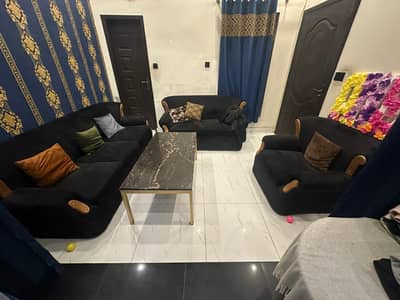Shining black very good condition 6 seater sofa set with brass table.