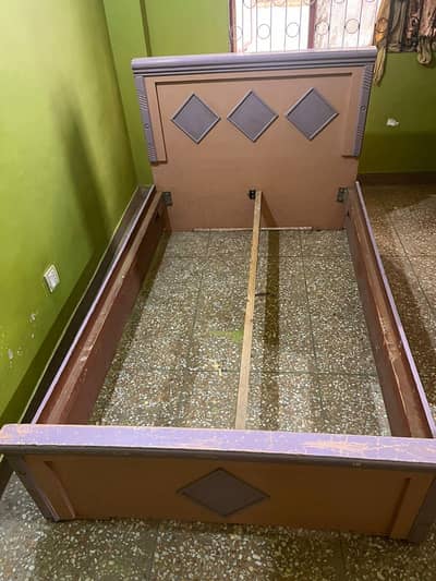 wooden single bed with mattress