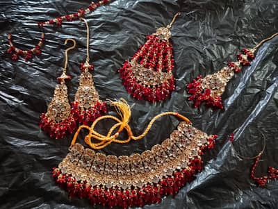 brand new stunning unused bridal jewelry set with gold and red work