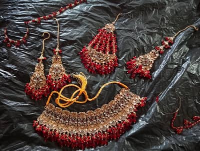 brand new stunning bridal jewelry set with gold and red  work/ party