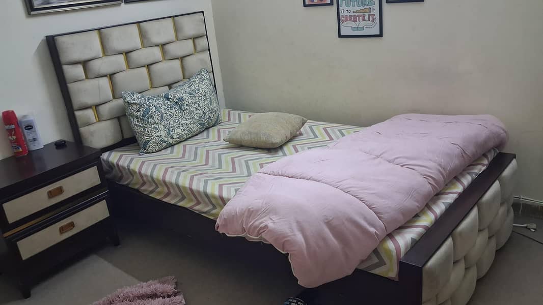 single bed with side table 0