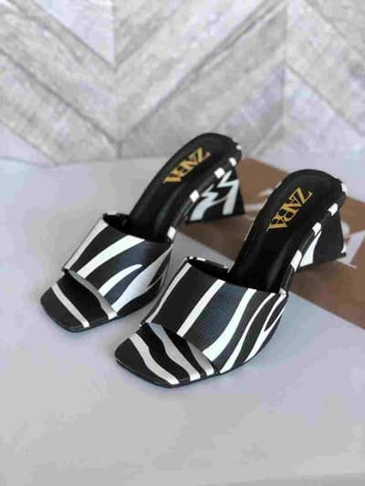 stylish woman's synthetic leather heals and slippers