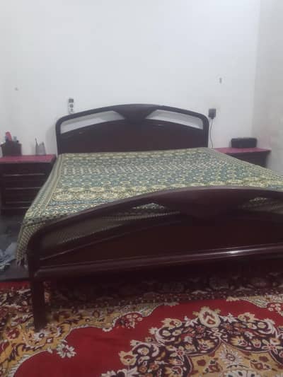 queen size bed with spring metrees with side table