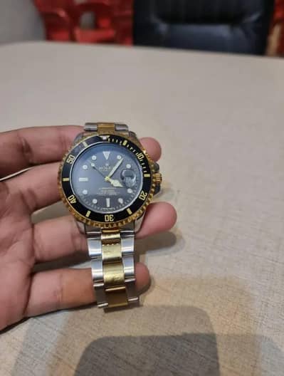 rolex submariner watch gold and black