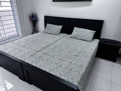 2 New Single Beds with a Side Table