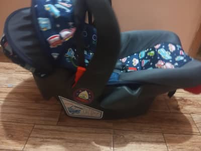 baby cot and carrier