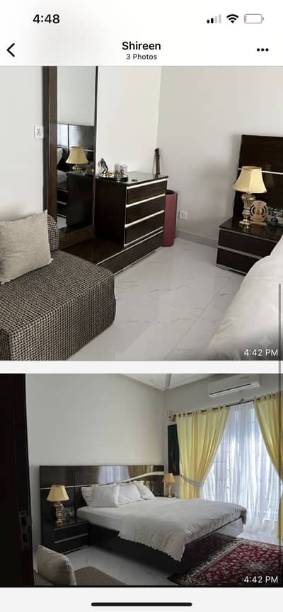 Wooden bed with side tables and dresser without mattress