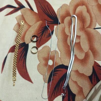 golden bracelet with a snake chain + silver chain + 2 rings