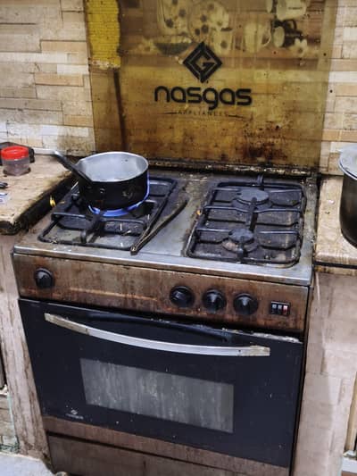 nas gas three stove oven with rotisserie and electricitic