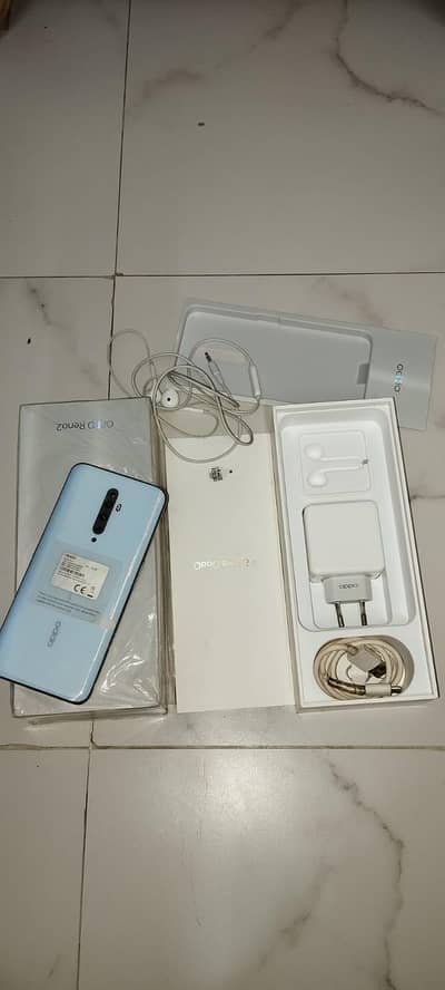 Reno 2 8/128 10/10 condition with original box charger