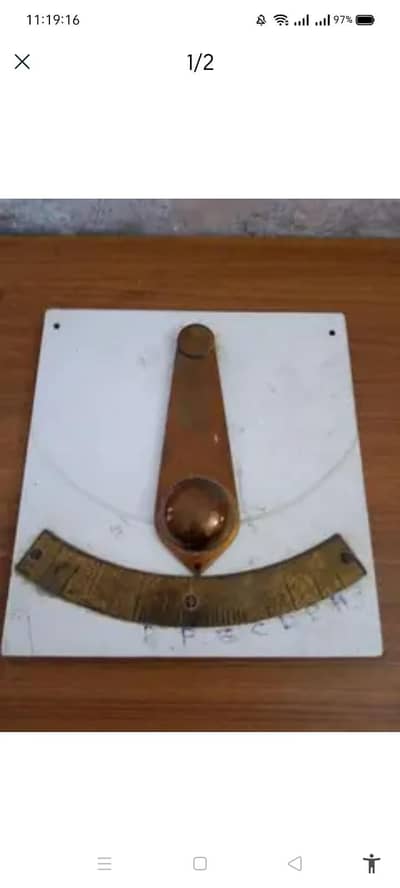 BRASS PENDULUM WALL MOUNTED .  TREAT AS A ANTIQUE SOUVENIR LOVERS