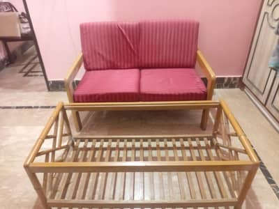 Good condition sofa with table and cushions