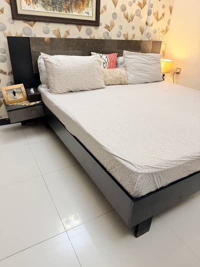 Very classy bed with side tables attached