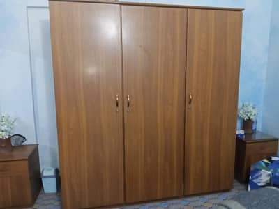 One hand used, Triple door cupboard + 2 side tables. NO WEAR AND TEAR!