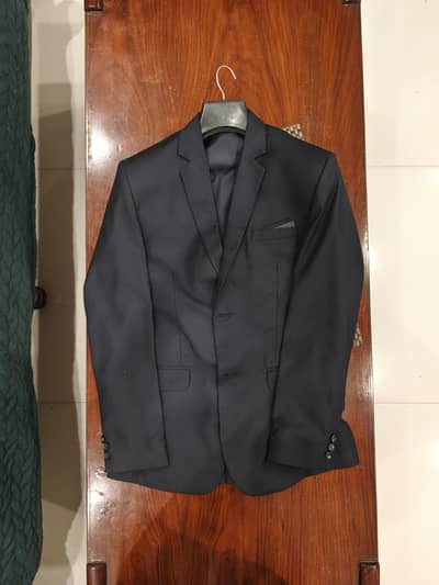 dark blue three piece suit (pant , coat, and waistcoat)