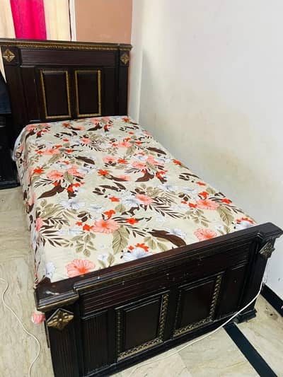 2 single wooden bed