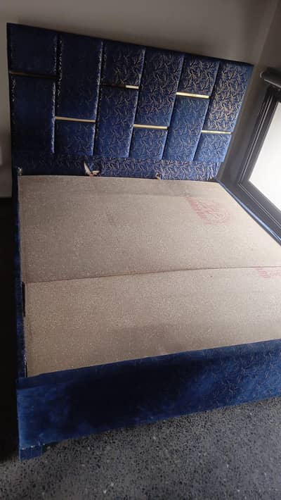 wooden double bed with mattress