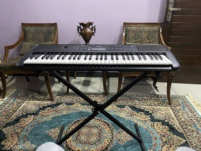 Yamaha PSR-E383 Digital Keyboard along with stand