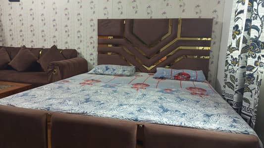 Bed with sofa and  dining table