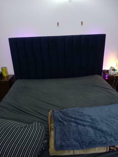 bed with side table and dressing table