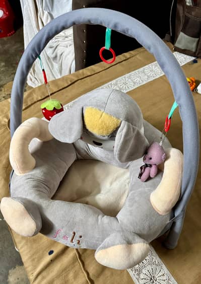 Baby plush sofa seat with hanging toys - Hardly used
