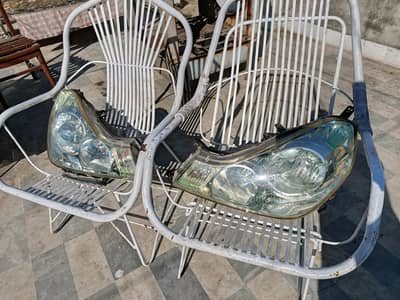 Genuine Nissan Y12 wingroad Glass headlight complete pair