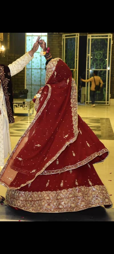 Heavy embroidered bridal lehnga with long frock