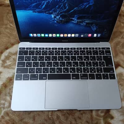 The MacBook specifications shown in the image are: - *Model*: MacBook