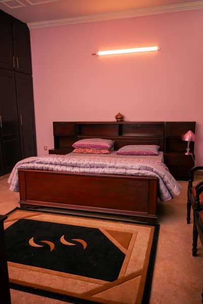 wooden beds with 2 bedside tables each