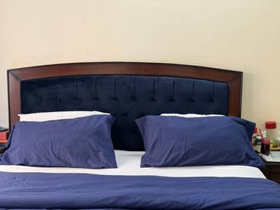 Blue velvet tufted bed with wood