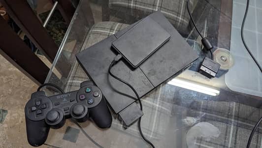 Playstation 2 with games hard drive, memory card and two controllers