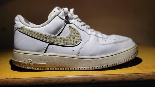 Nike Air Force 1 Low – White Color with “Just Do It” Printed Swoosh.