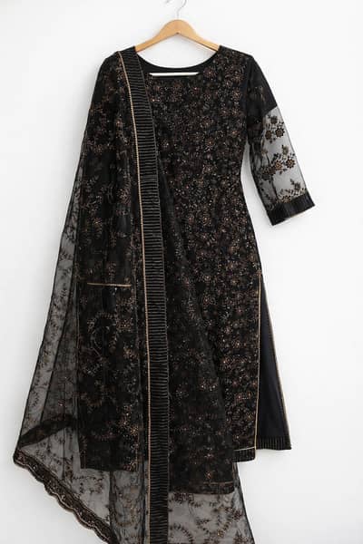 Luxury chiffon net black dress with heavy sequence work.