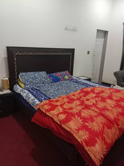 bed with side drawers and dressing table