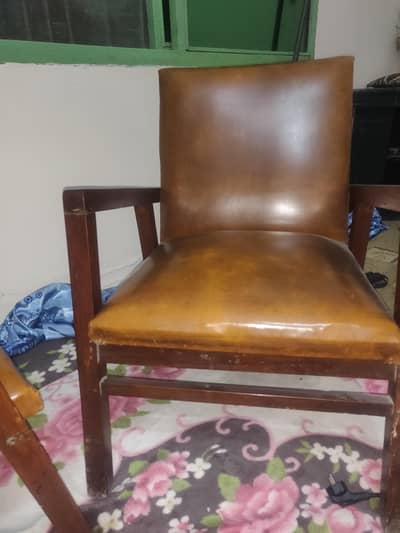 vintage wooden arm chair with leather seat and back rest